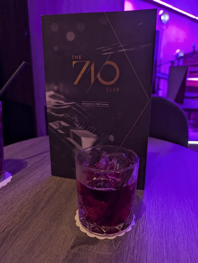 A photo of a 710s Negroni and the drinks menu